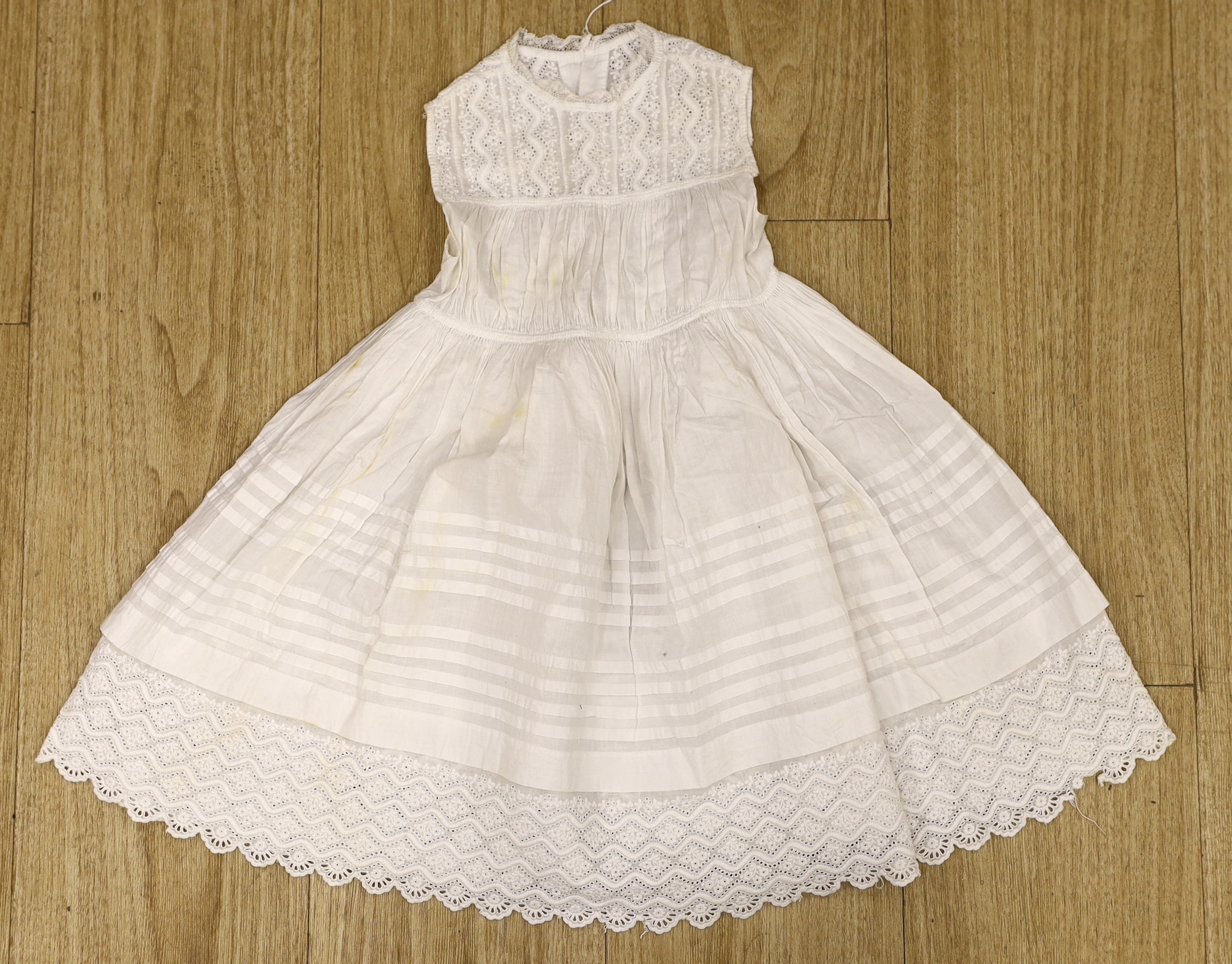 Five 19th century white worked and embroidery anglaise christening gowns, six similar baby dresses a cream wool silk embroidered shawl and a knitted shawl etc